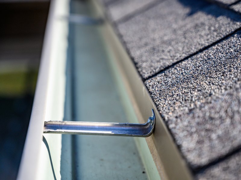 cleaning gutters on a residential home